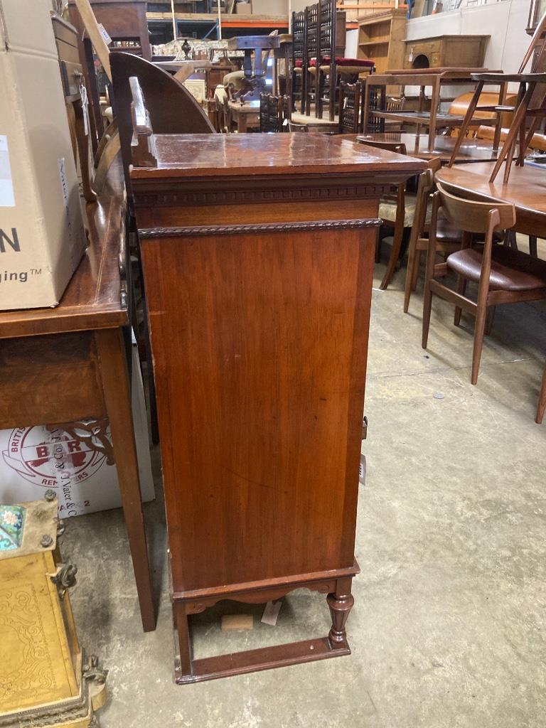 A mahogany cabinet stamped 'Admiral's day cabin 425', width 63cm, depth 42cm, height 115cm
